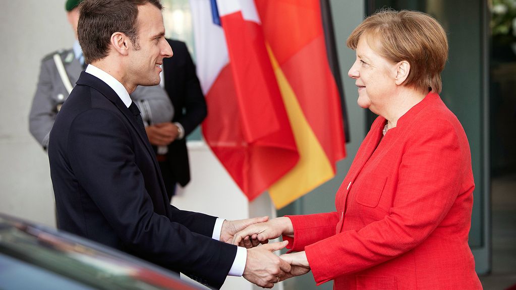 Chancellor Angela Merkel and French President Emmanuel Macron in front of the Federal Chancellery in Berlin
