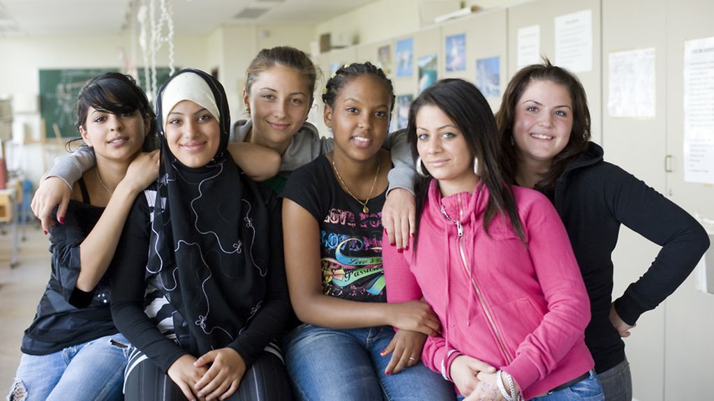 Six schoolgirls in a classroom