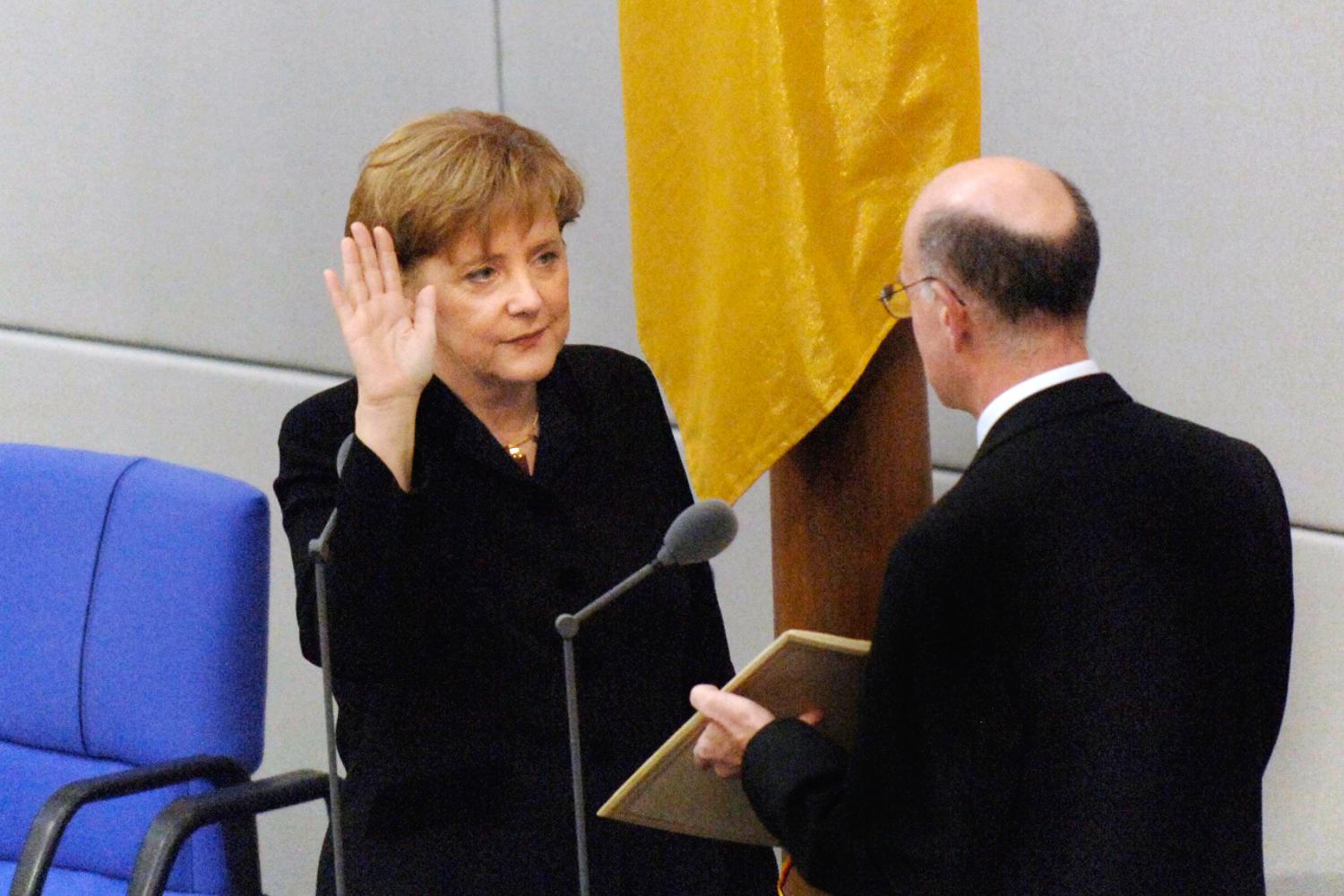 Federal Chancellor Angela Merkel is sworn in by the President of the Bundestag, Norbert Lammer, in 2005