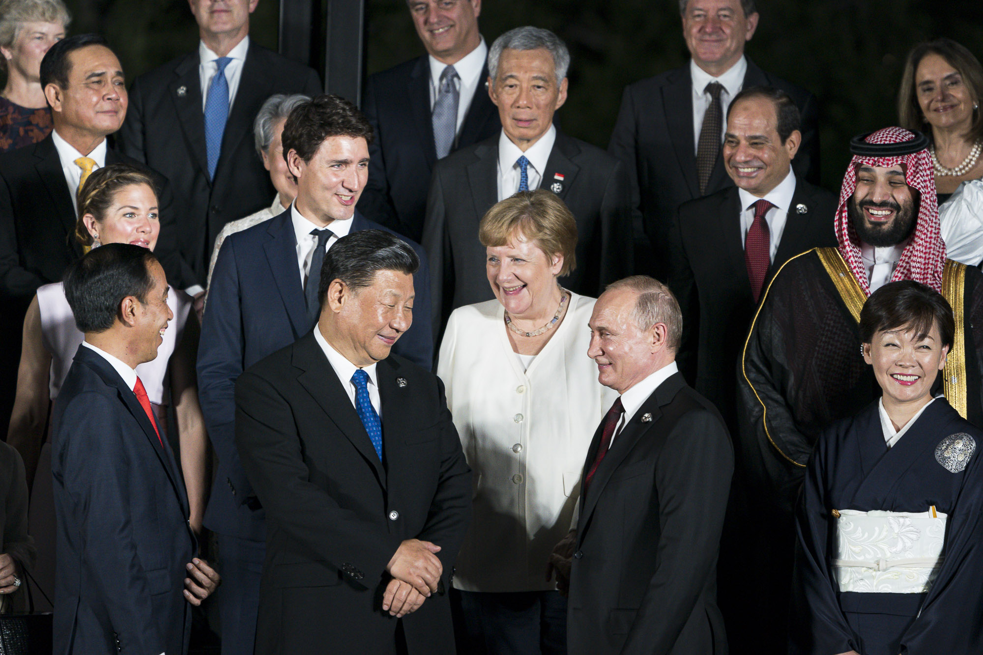 Chancellor Angela Merkel in conversation with Chinese President Xi Jinping and Russian President Vladimir Putin at the G20 summit in Osaka