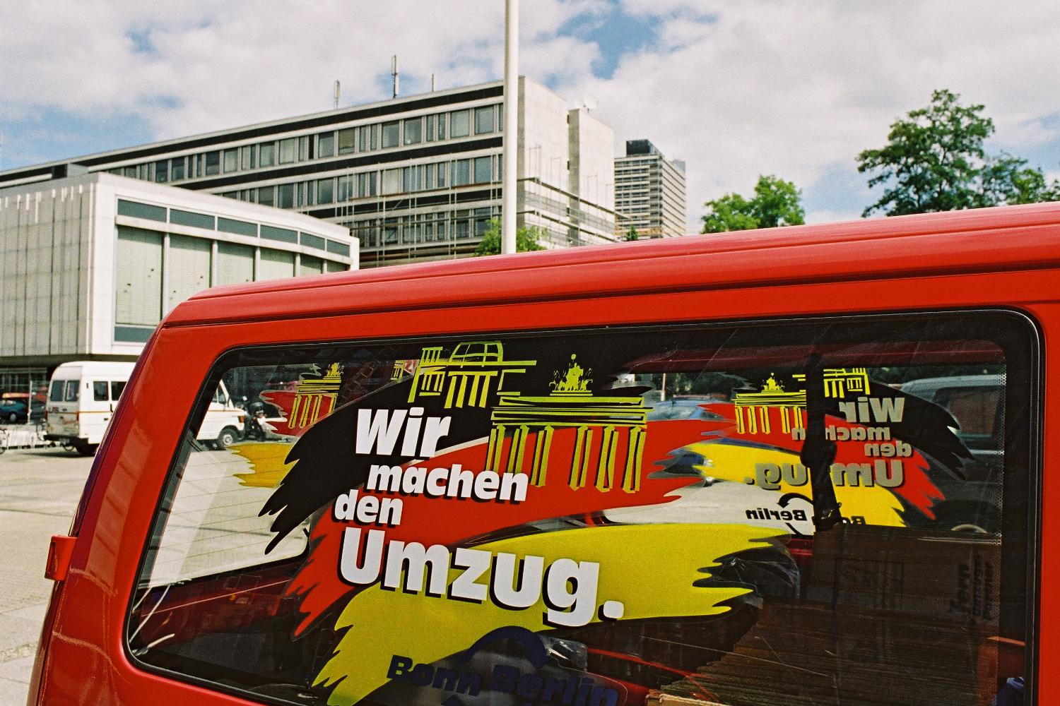 The advertising slogan on the side of a removal company's van reads "We're doing the move"