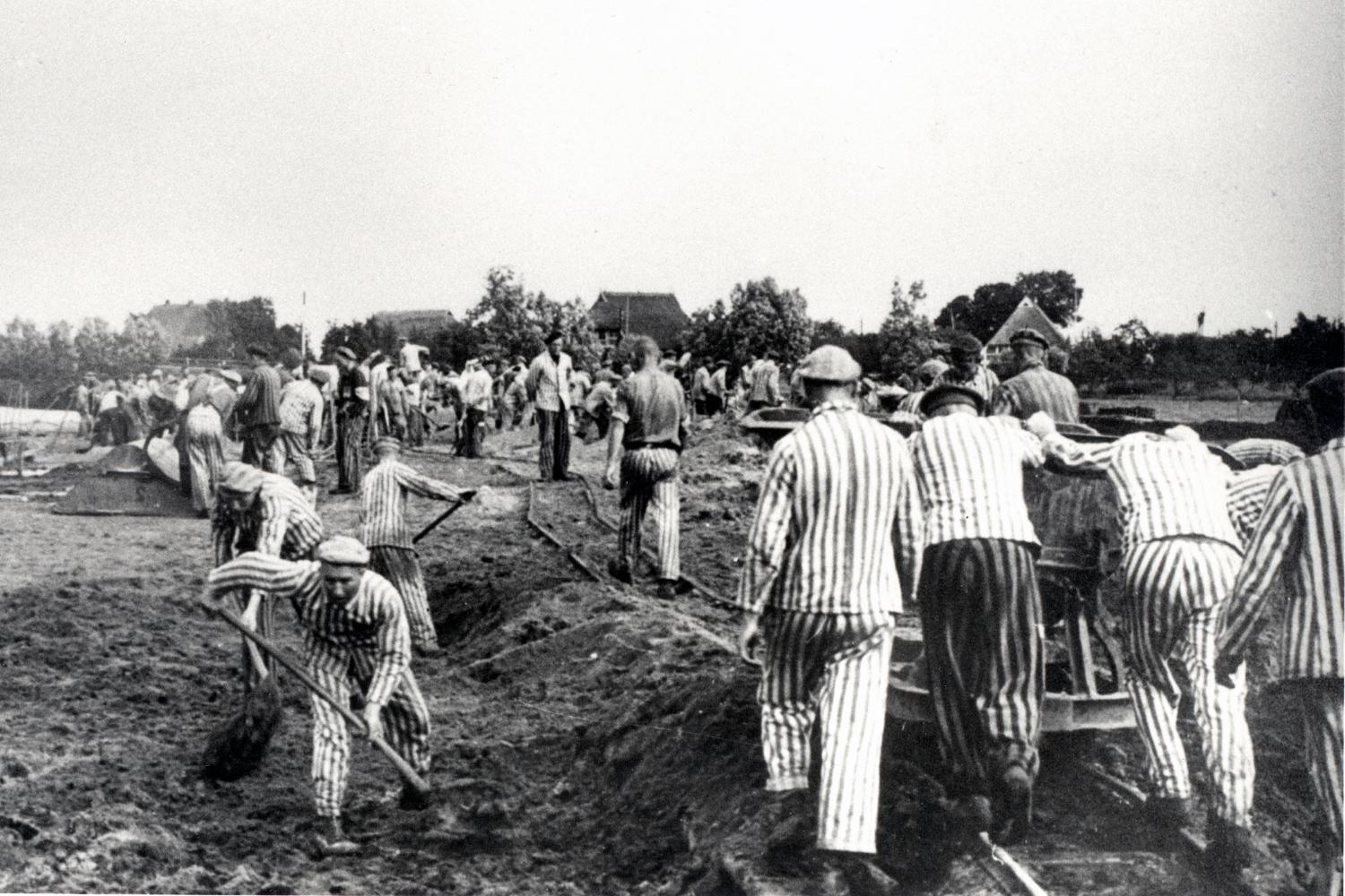 Prisoners from Neuengamme concentration camp dig the branch canal from the brickworks to the River Dove-Elbe.