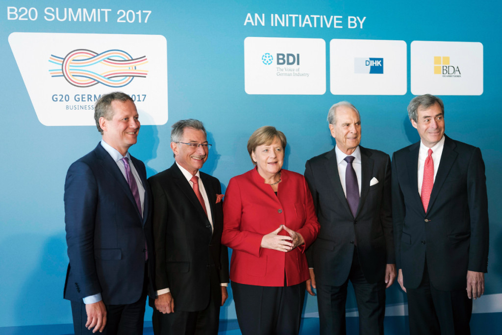 Chancellor Angela Merkel (centre) with leading business representatives during the Business20 (B20) summit in Berlin