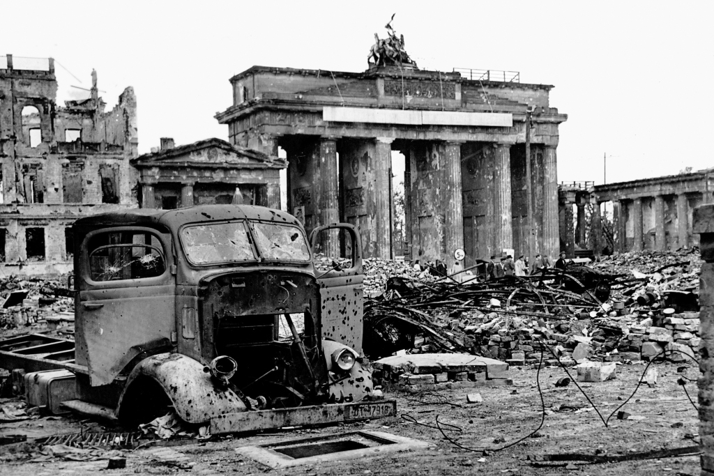 Brandenburg Gate amidst the rubble and ruins at the end of WWII (May 1945).