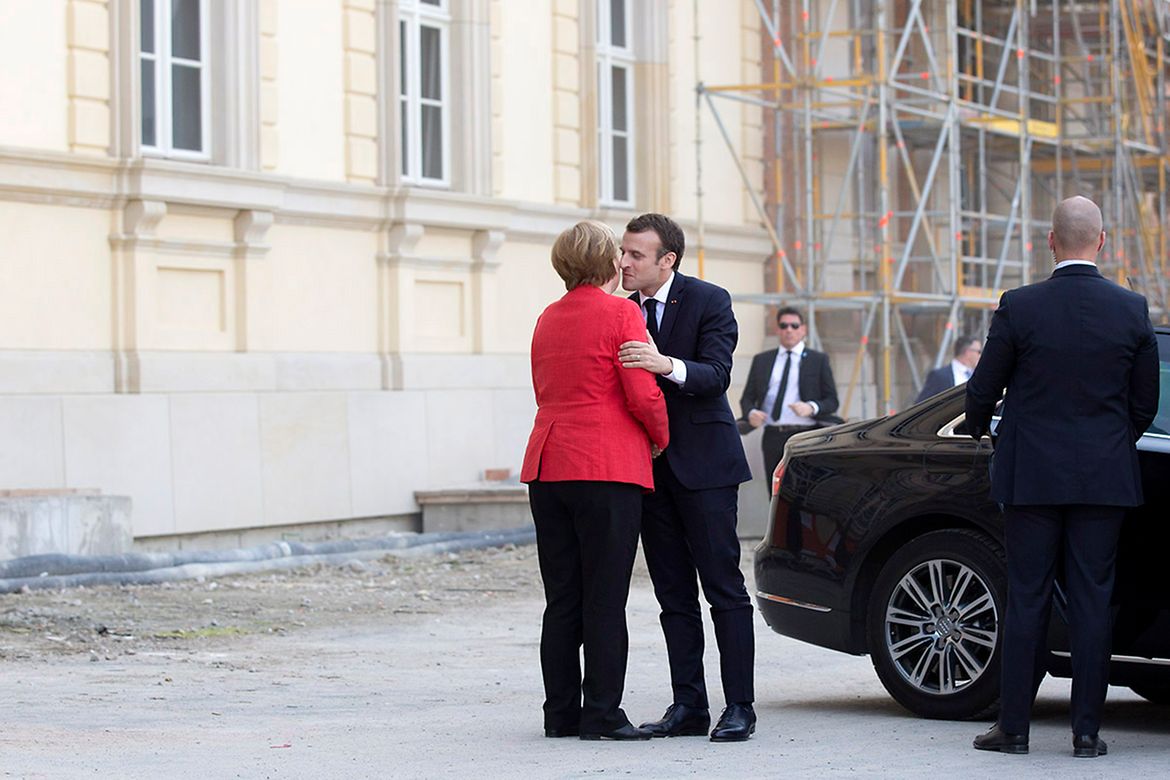 Chancellor Angela Merkel welcomes French President Emmanuel Macron.