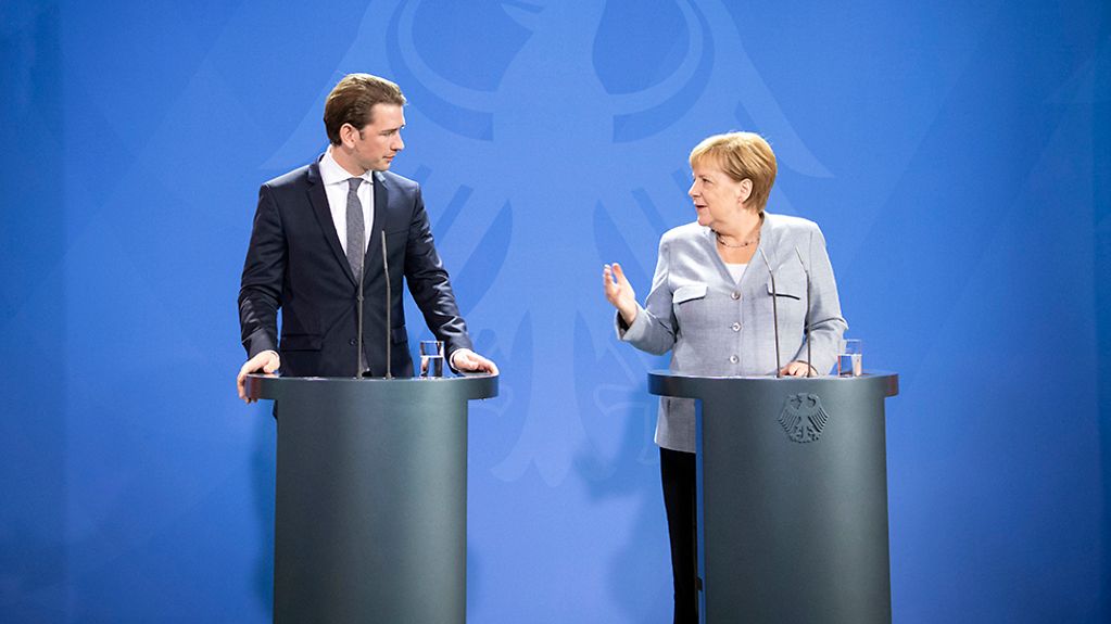 Chancellor Angela Merkel and Austrian Chancellor Sebastian Kurz deliver their statements at the press conference.