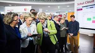 Ursula von der Leyen, Federal Defence Minister, and Minister of State Monika Grütters, Federal Government Commissioner for Culture and the Media test an application.