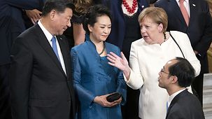Angela Merkel speaks with Chinese President Xi Jinping.