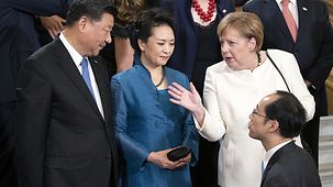 Angela Merkel parle avec le président chinois Xi Jinping
