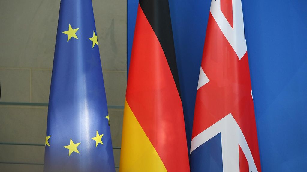EU, German and British flags side by side