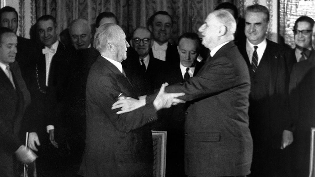 Chancellor Konrad Adenauer (at left) and Charles de Gaulle, President of France (at right), following the signing of the Elysée Treaty