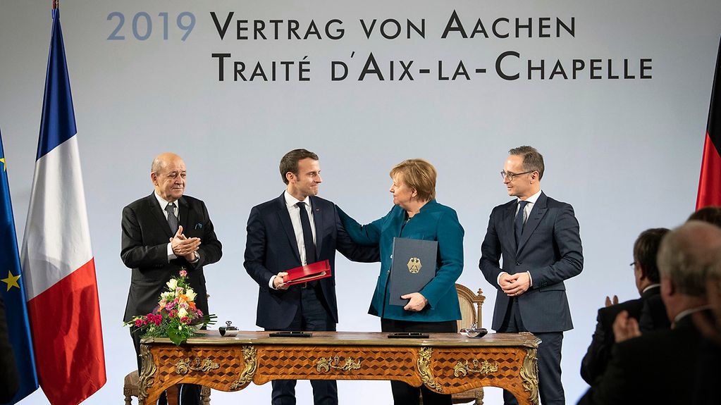 Chancellor Angela Merkel and French President Emmanuel Macron at the ceremony to sign the Treaty of Aachen.