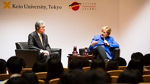 Chancellor Angela Merkel speaks during a discussion with students at Keio University.