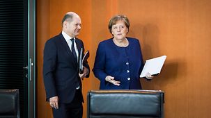 Chancellor Angela Merkel in discussion with Olaf Scholz, Federal Finance Minister