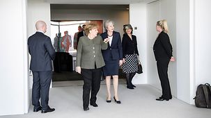 Chancellor Angela Merkel in conversation with British Prime Minister Theresa May