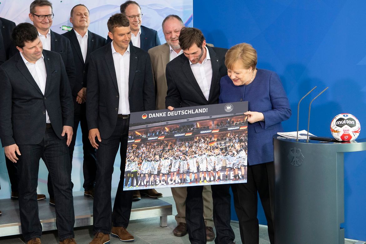 Chancellor Angela Merkel receives Germany's national handball team.