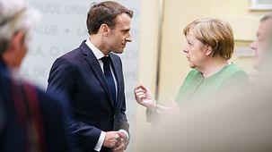 Chancellor Angela Merkel in discussion with French President Emmanuel Macron at the informal meeting of the European Council in Sibiu