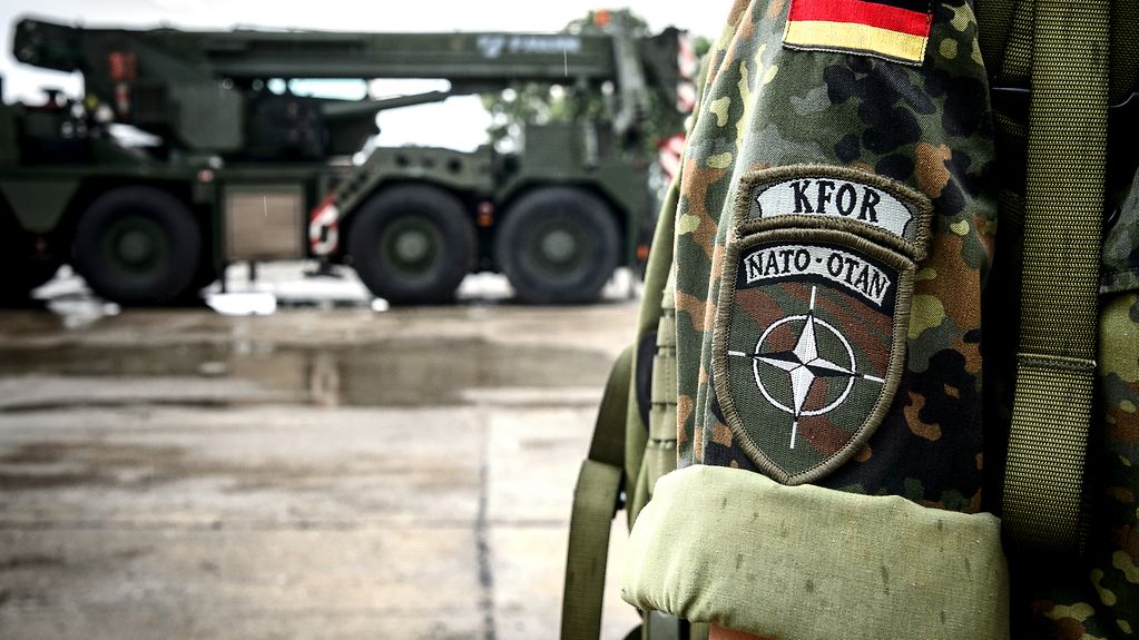 A KFOR badge on the sleeve of a soldier's uniform