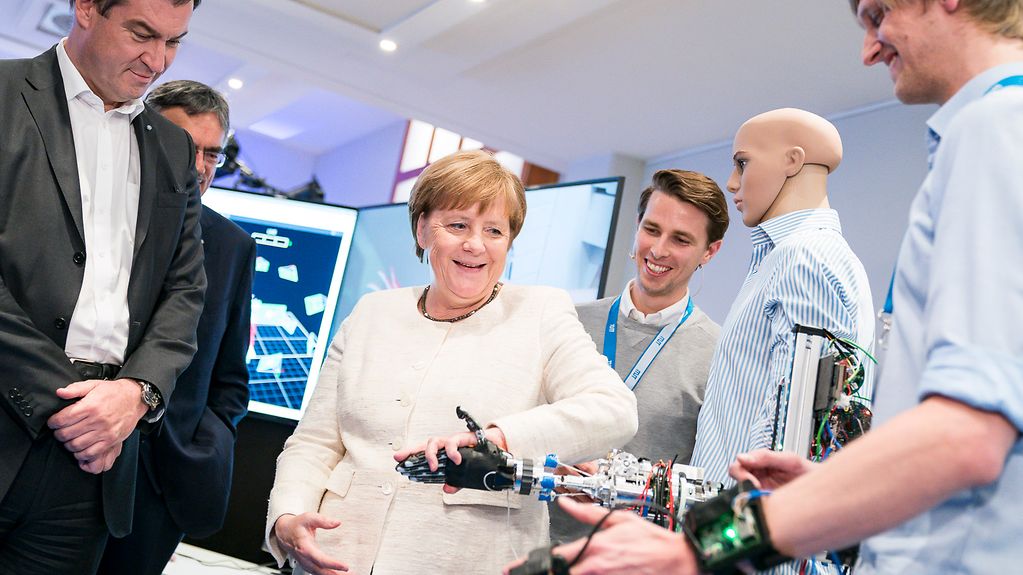 Chancellor Angela Merkel during a guided tour of one of the laboratories of the Munich School of Robotics and Machine Intelligence