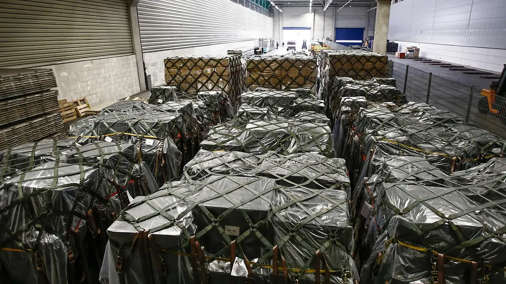 Armaments on palettes in a transport plane.