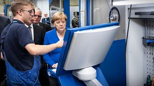 Angela Merkel tours the Siemens turbine plant.
