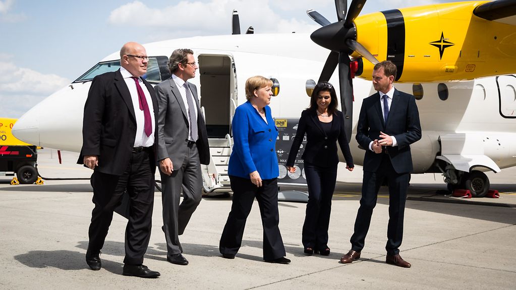 Chancellor Angela Merkel arrives at the First National Aviation Conference.