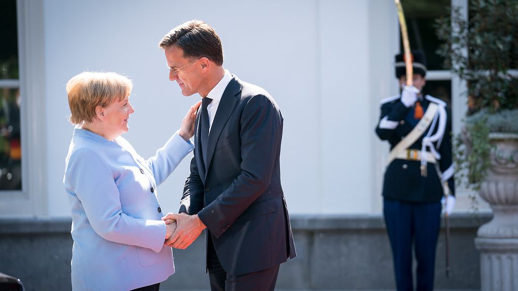 Chancellor Angela Merkel and Mark Rutte, Prime Minister of the Netherlands, greet one another.