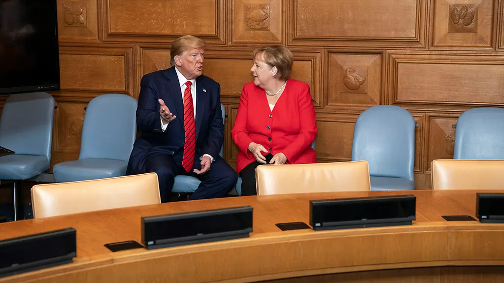 Chancellor Angela Merkel in discussion with President Donald Trump