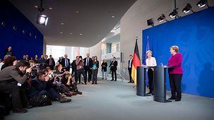 Chancellor Angela Merkel in conversation with Ursula von der Leyen, designated President of the European Commission