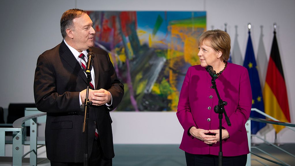 Chancellor Angela Merkel gives a statement to the press with US Secretary of State Mike Pompeo.