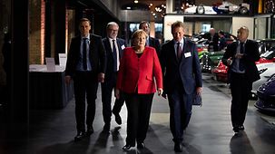 Chancellor Angela Merkel arrives at the annual meeting of the Association of German Chambers of Industry and Commerce.
