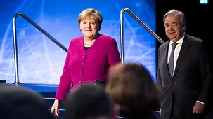 Chancellor Angela Merkel walks beside António  Guterres, United Nations Secretary-General.