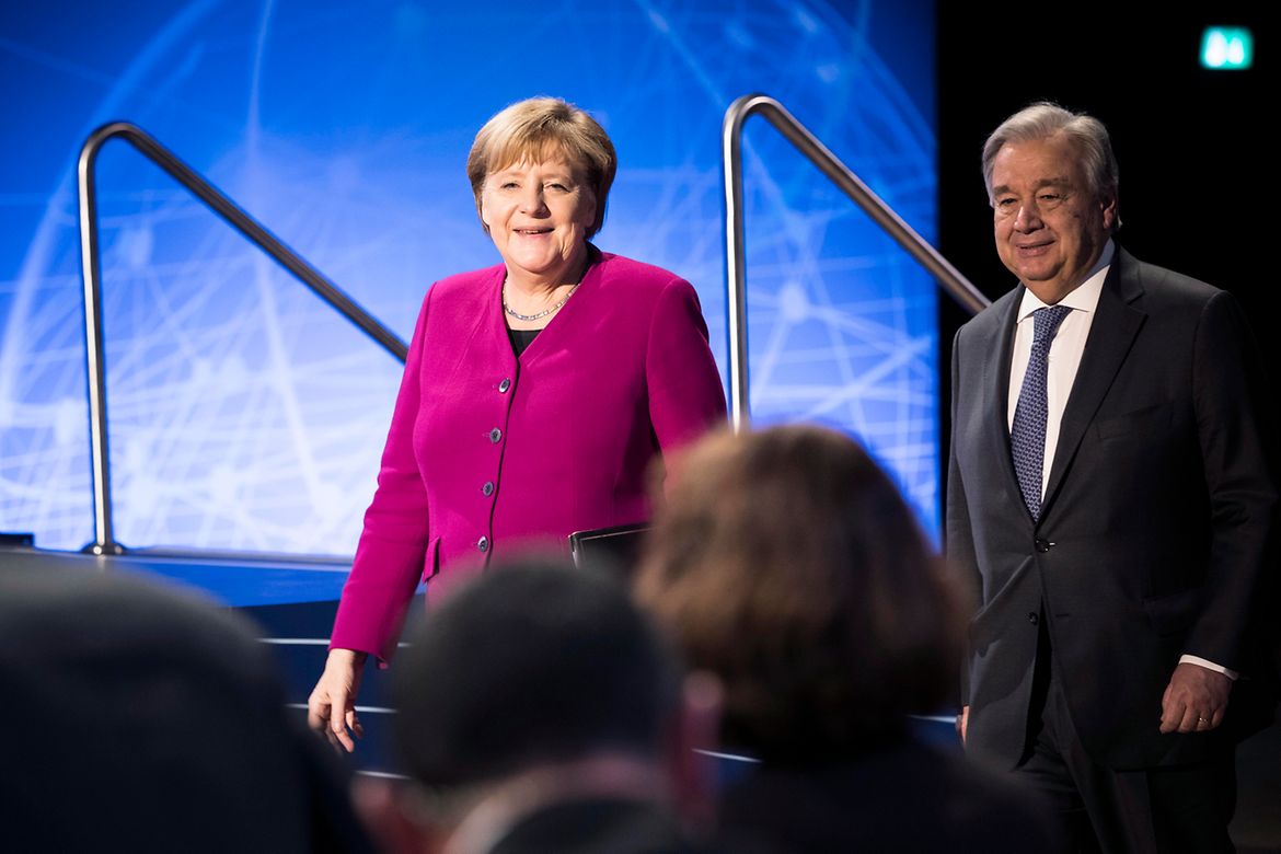 Chancellor Angela Merkel walks beside António  Guterres, United Nations Secretary-General.