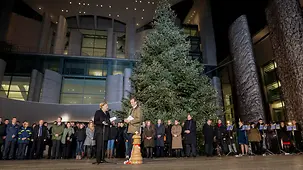 Chancellor Angela Merkel is presented with the Christmas trees at the Federal Chancellery.