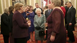 Chancellor Angela Merkel in conversation with Queen Elizabeth II