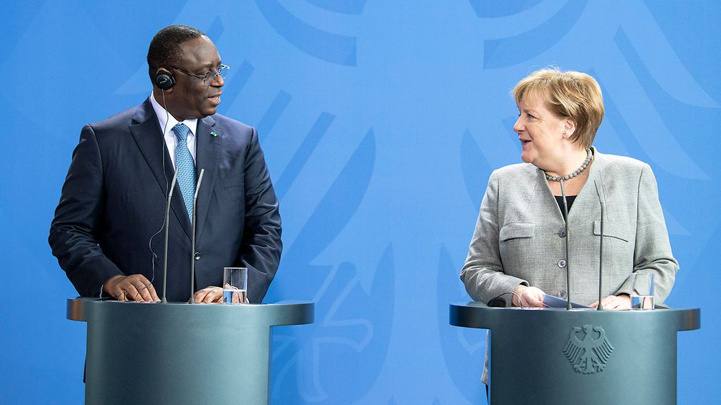 Chancellor Angela Merkel with Macky Sall, Senegal's President, during a press conference