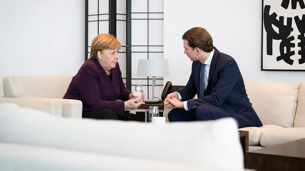 Chancellor Angela Merkel in discussion with Austrian Chancellor Sebastian Kurz