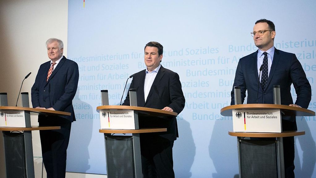 Cabinet ministers Horst Seehofer, Hubertus Heil and Jens Spahn give a press conference at the Federal Ministry of Labour.