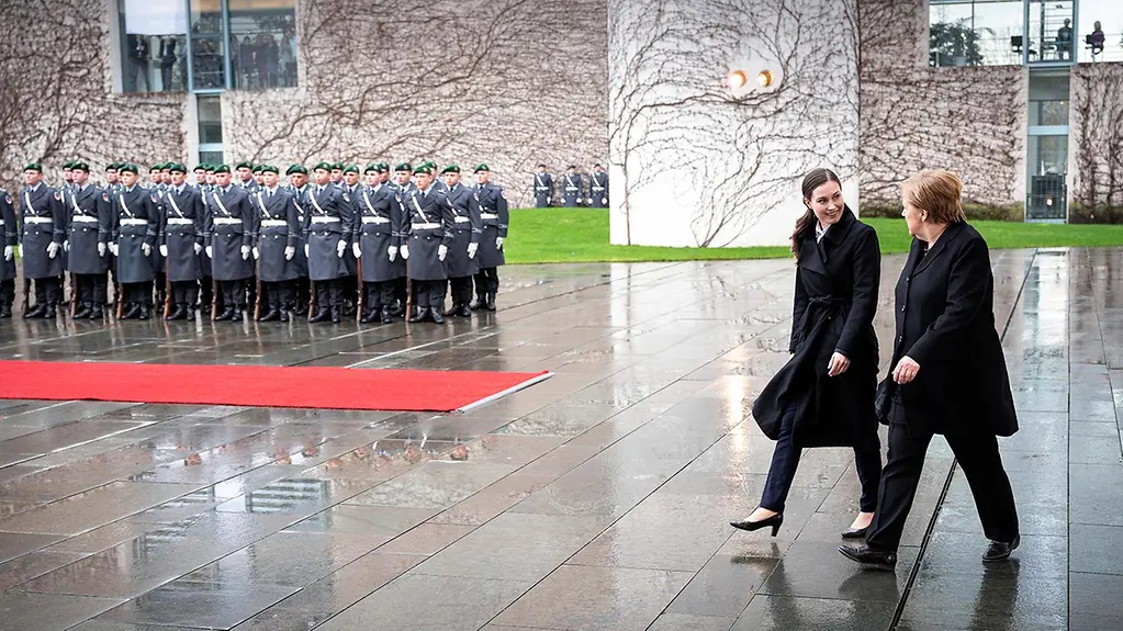 Chancellor Angela Merkel welcomes Finnish Prime Minister Sanna Marin with military honours at the Federal Chancellery.