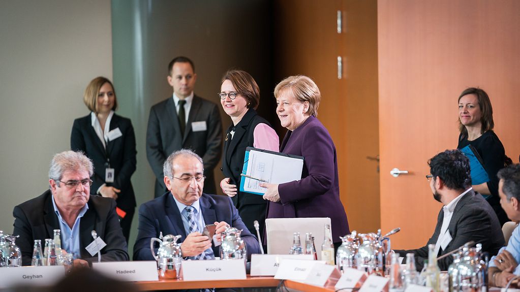 Chancellor Angela Merkel with representatives of migrants' organisations