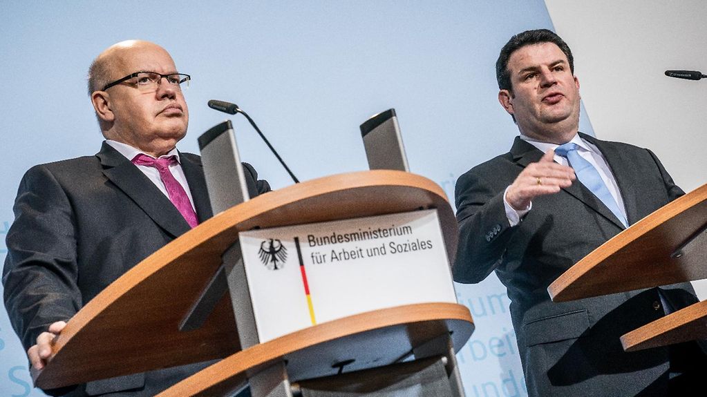 Federal Economic Affairs Minister Peter Altmaier and Federal Labour Minister Hubertus Heil at a press conference