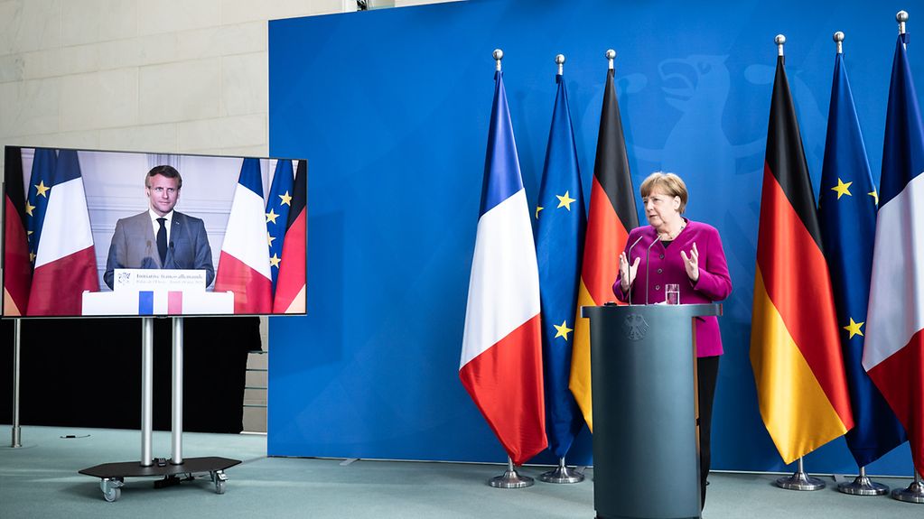 Chancellor Angela Merkel gives a press conference with French President Emmanuel Macron.