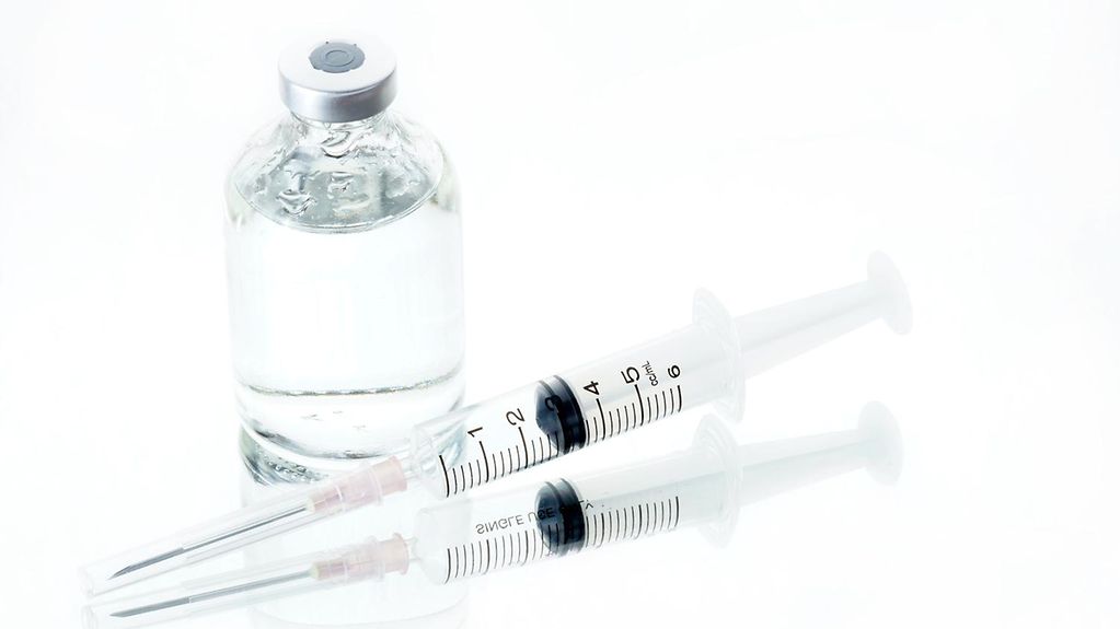 Syringe with ampoule