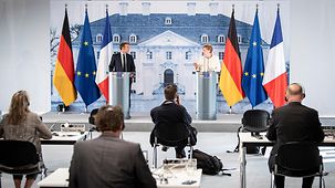 Bundeskanzlerin Angela Merkel und Frankeichs Präsident Emmanuel Macron geben eine Pressekonferenz auf Schloss Meseberg.