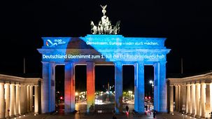 The Brandenburg Gate is illuminated with the motto of Germany's Presidency of the Council of the European Union – "Together for Europe's recovery".