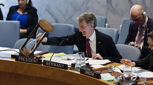 Christoph Heusgen, German Ambassador to the UN, turns an hourglass from Thuringia. It is intended to remind speakers about the five-minute limit on speeches in the Security Council.