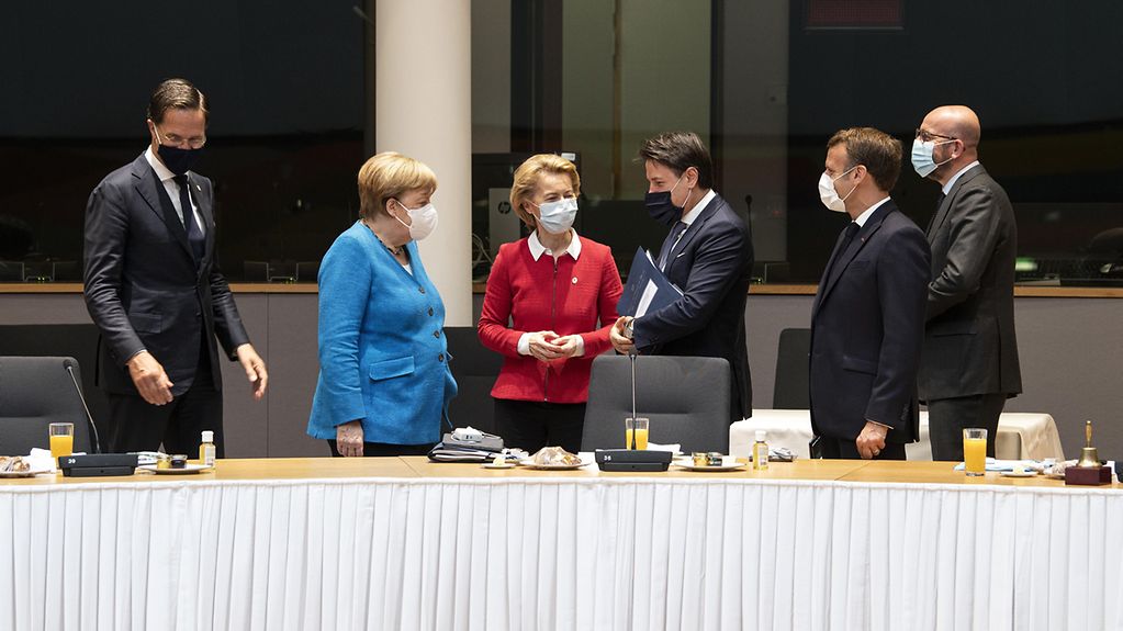 Chancellor Angela Merkel in discussion during a meeting of the European Council