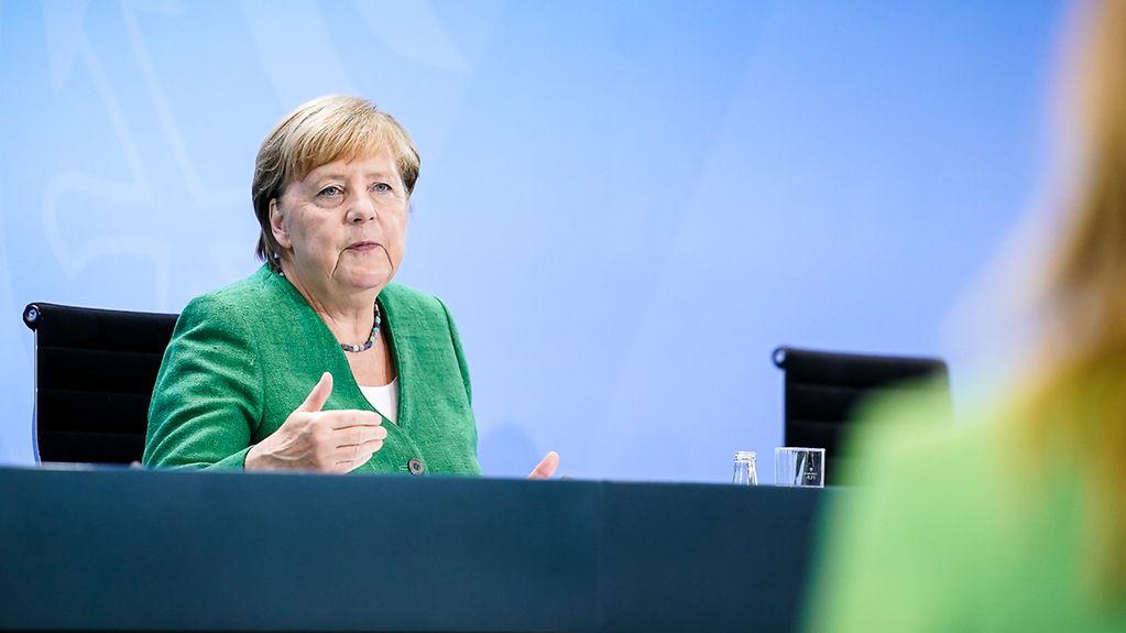 Chancellor Angela Merkel speaks at a press conference following her video conference with the state premiers.