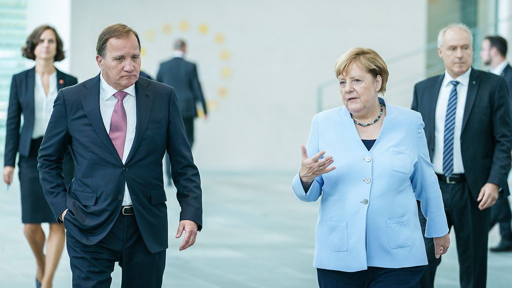 Chancellor Angela Merkel in conversation with Stefan Löfven, Sweden's Prime Minister