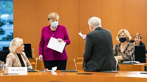 Chancellor Angela Merkel in discussion with Horst Seehofer, Federal Minister of the Interior, Building and Community, before the start of the Cabinet meeting